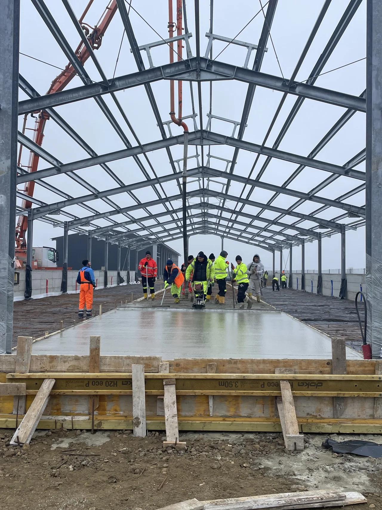 Beavers crew pouring and levelling a concrete floor