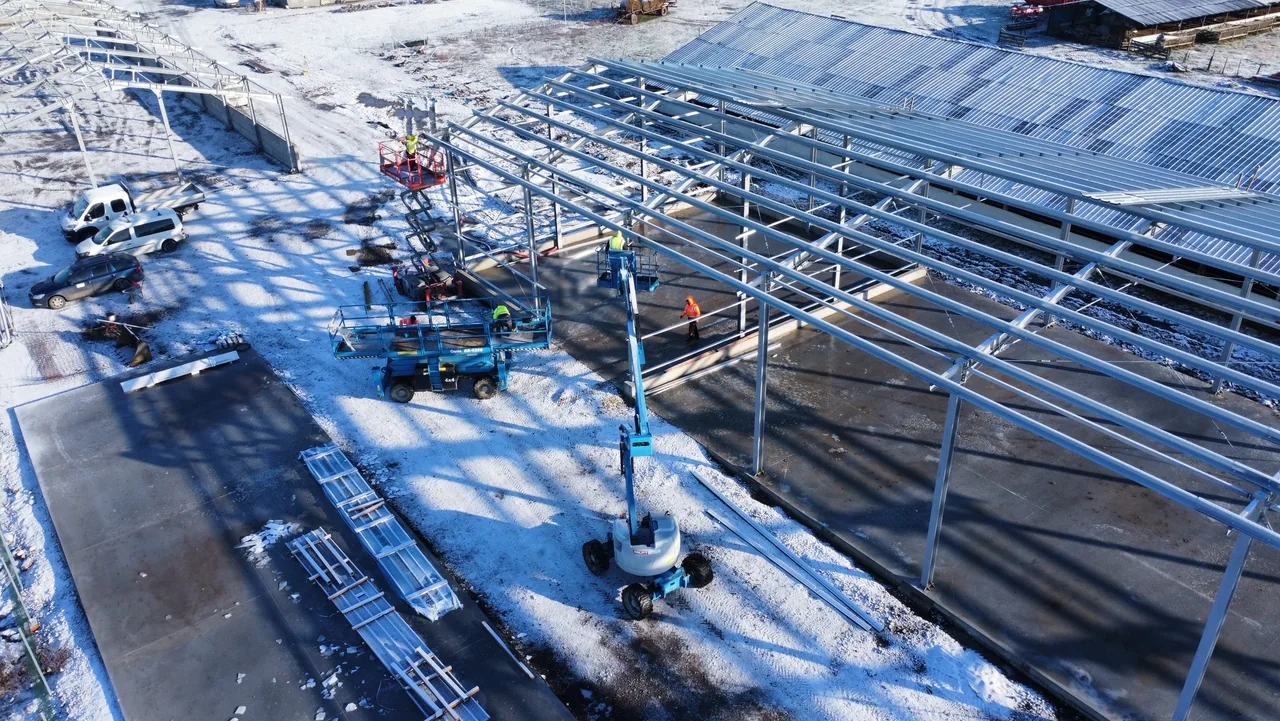 Aerial view of crews erecting steel structures